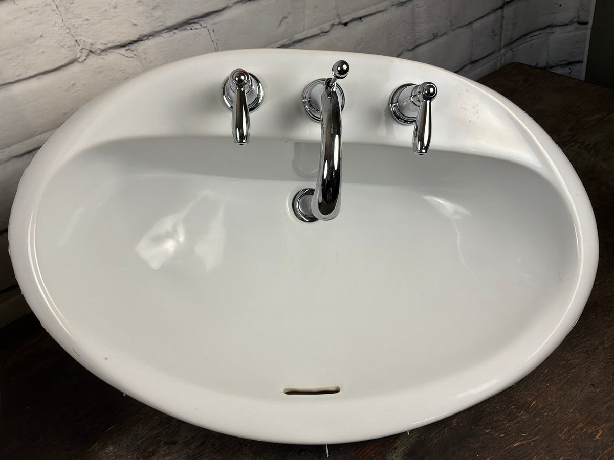 Porcelain Bathroom Sink with Moen Taps