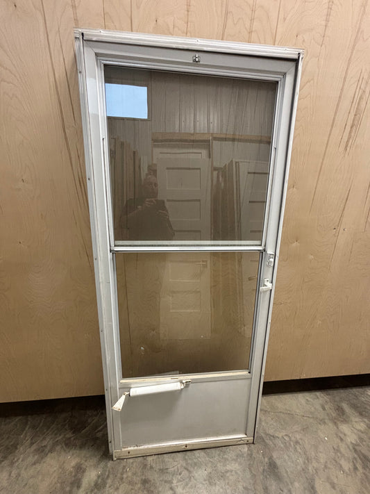 Screen door in frame